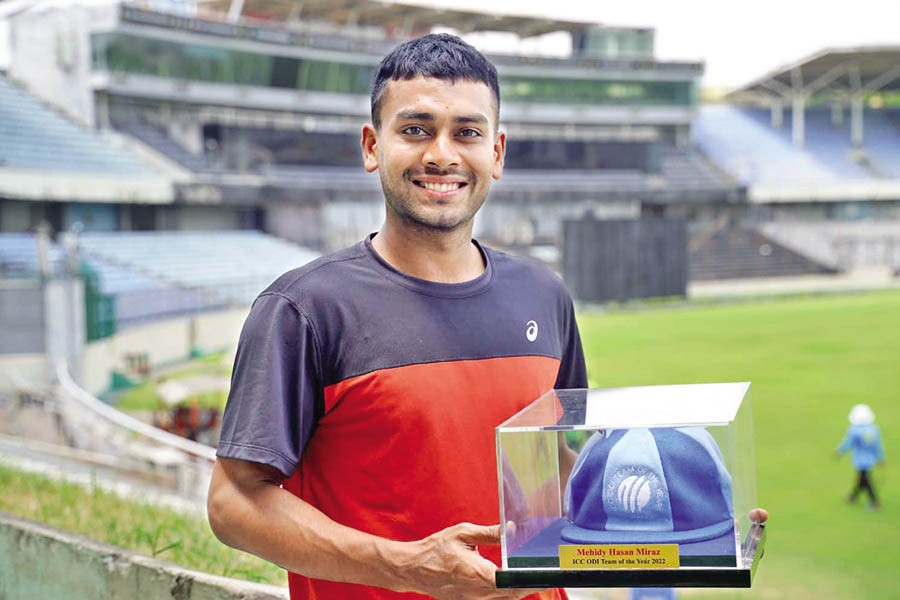 Mehidy Hasan Miraz holding his souvenir honorary cap sent by the ICC — Facebook
