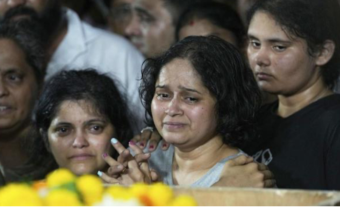 Family members have mourned people killed in an attack on tourists in the Pahalgam area of Kashmir. (AP PHOTO)