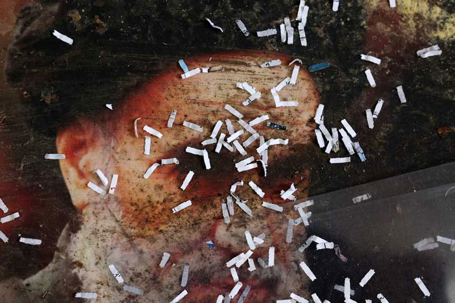 Pieces of shredded documents are scattered on a poster of Iran's Supreme Leader Ayatollah Ali Khamenei, at the Iranian embassy in Damascus, Syria, December 16, 2024.