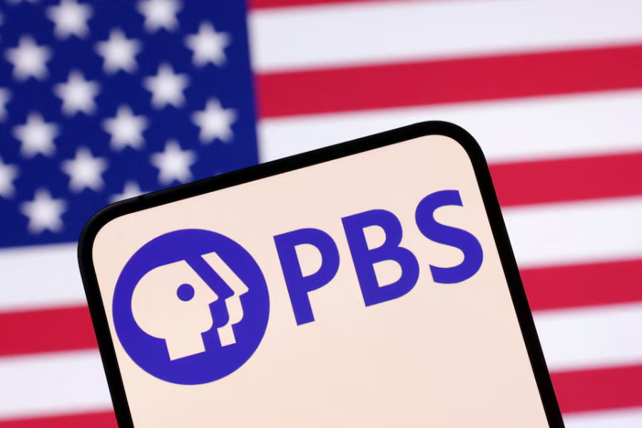 Public Broadcasting Service (PBS) logo and U.S. flag are seen in this illustration taken April 23, 2025.