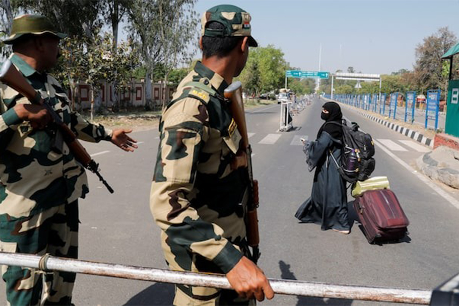 A woman crosses a Border Security Force (BSF) checkpoint at the Attari-Wagah crossing on the India-Pakistan border near Amritsar, following Tuesday’s attack on tourists near south Kashmir’s scenic Pahalgam, India on April 25, 2025 — Reuters photo