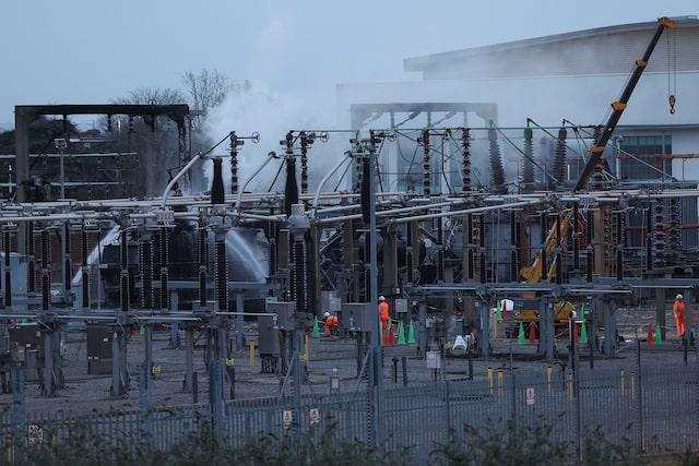 People work at an electrical substation, after a fire there wiped out the power at Heathrow International Airport, in Hayes, London, Britain, March 21, 2025. REUTERS/Isabel Infantes/File Photo