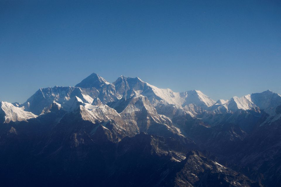 Mount Everest, the world highest peak, and other peaks of the Himalayan range are seen through an aircraft window during a mountain flight from Kathmandu, Nepal January 15, 2020. REUTERS/Monika Deupala