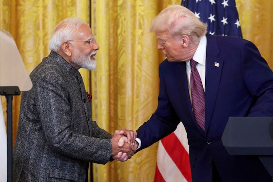 US President Donald Trump and Indian Prime Minister Narendra Modi shake hands as they attend a joint press conference at the White House in Washington, DC, US, February 13, 2025.