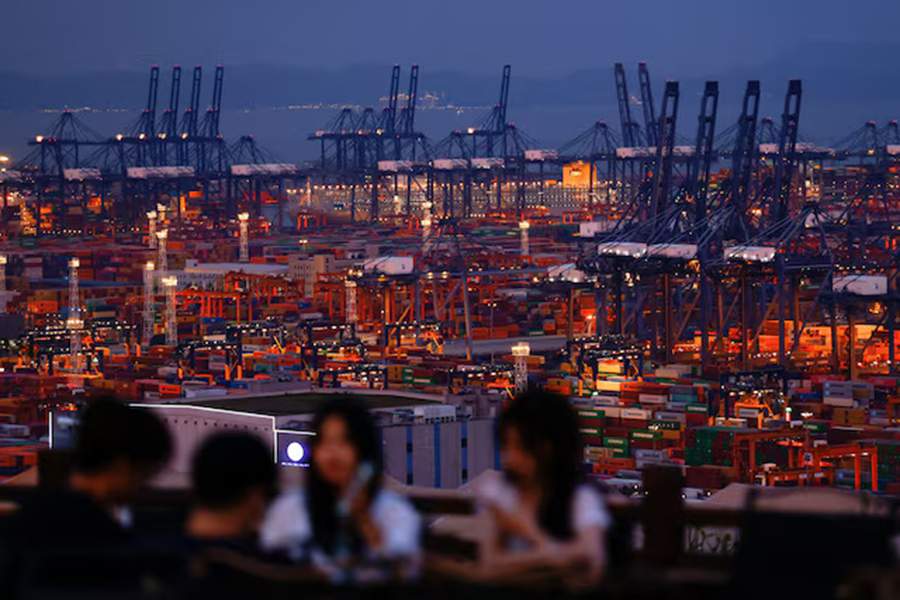 People enjoy their time on a hill overlooking Yantian port in Shenzhen, Guangdong province, China on May 9, 2025 — Reuters photo