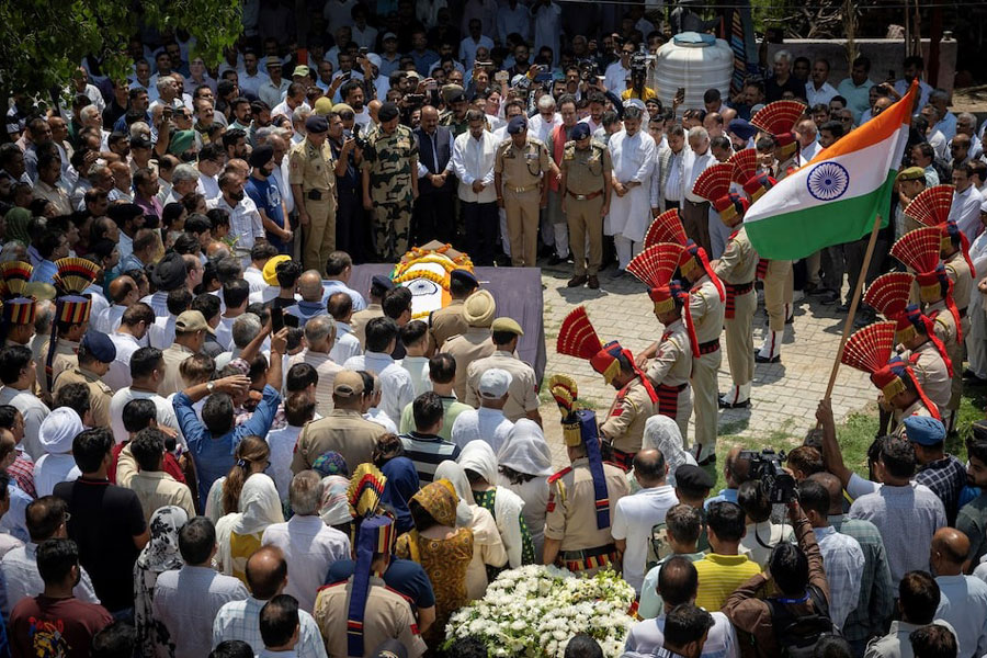 Indian policemen pay their respects during the funeral of Raj Kumar Thapa, a senior government official who was killed in a cross-border shelling between India and Pakistan, in Roop Nagar, Jammu May 11, 2025.