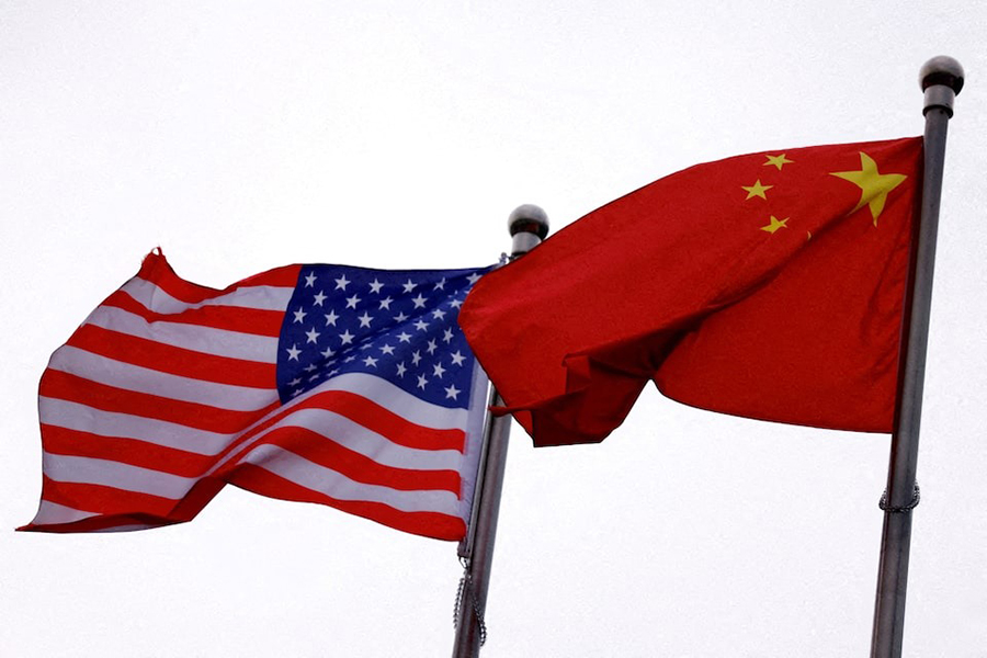 Chinese and US flags flutter outside the building of an American company in Beijing, China on April 8, 2025 — Reuters/File