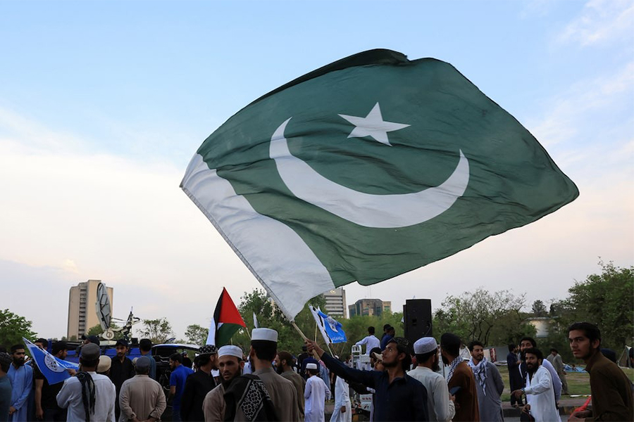 A man waves Pakistan's flag as he along with others gather in support of Pakistan Army, day after the ceasefire announcement between India and Pakistan, in Islamabad, Pakistan on May 11, 2025 — Reuters photo