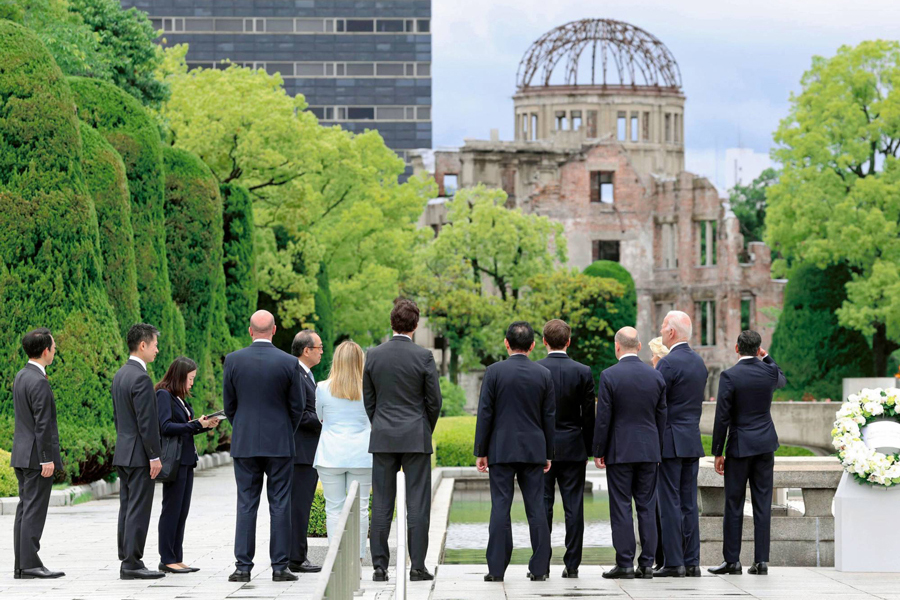 G7 leaders listen as Hiroshima Mayor Kazumi Matsui (fifth from left) explains the history behind the Atomic Bomb Dome in Hiroshima on Friday —Agency Photo