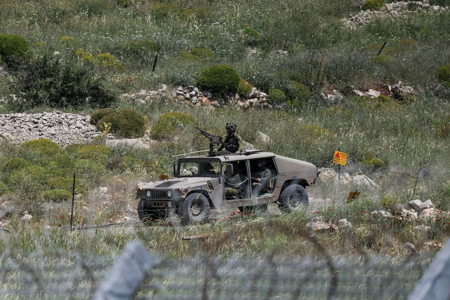 An Israeli military vehicle is seen near the border between the Israeli-occupied Golan Heights and Syria, May 4, 2025.
