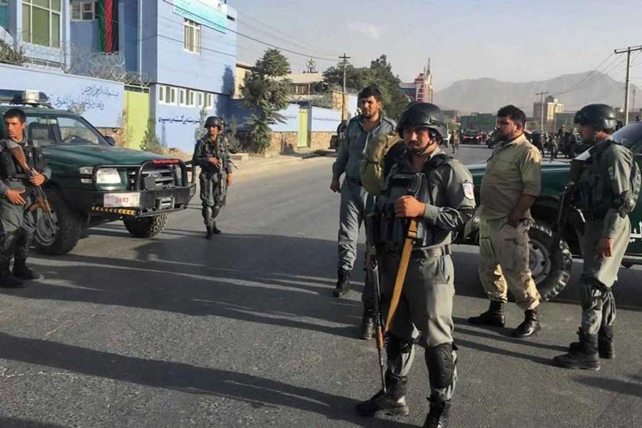 Afghan security police stand guard near the site of a deadly suicide attack outside a cricket stadium in Kabul on September 13, 2017. - AP photo