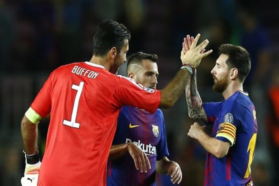 Barcelona's Lionel Messi shakes hands with Juventus goalkeeper Gianluigi Buffon at the end of a group D Champions League soccer match between FC Barcelona and Juventus at the Camp Nou stadium at Barcelona in Spain on Tuesday. — AP