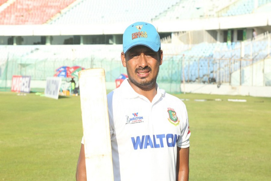 Mohammad Ashraful poses with his bat after scoring century in the match between Dhaka Metro and Chittagong Division during the four-day Walton 19th National Cricket League (NCL) at Zahur Ahmed Chowdhury Stadium in Chittagong on Friday. — bdnews24.com