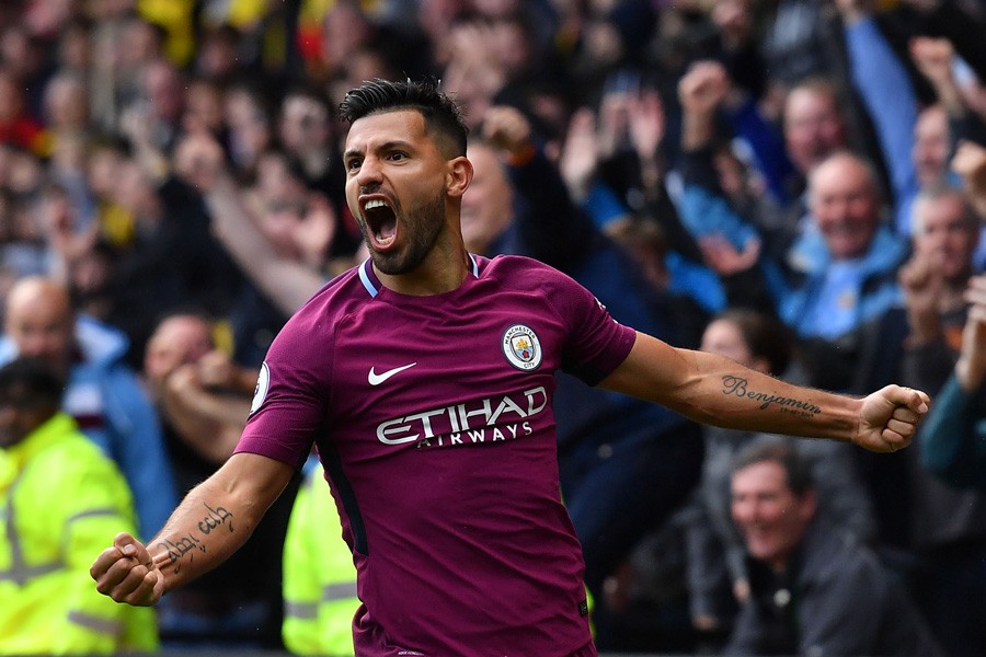 Manchester City's Argentinian striker Sergio Aguero celebrates scoring his third and the team's fifth goal against Watford on Saturday. — Reuters