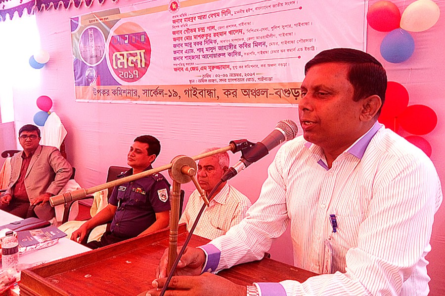 DC Gautam Chandra Pal addressing the inaugural session of the four-day Income Tax Fair-2017 arranged by the Deputy Commissioner of Taxes, Circle 19, Gaibandha, on its office premises in the town on Thursday. — FE Photo