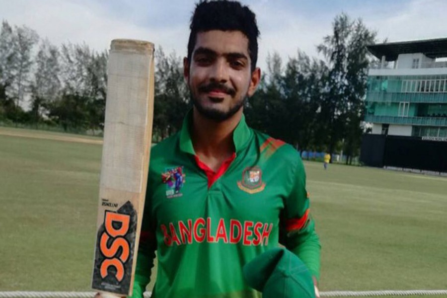 Towhid Hridoy poses with his bat after scoring century in the match between Bangladesh and Malaysia during the ACC Youth Asia Cup Cricket 2017 at Bayuemas Oval in Kuala Lumpur on Monday. — bdnews24.com