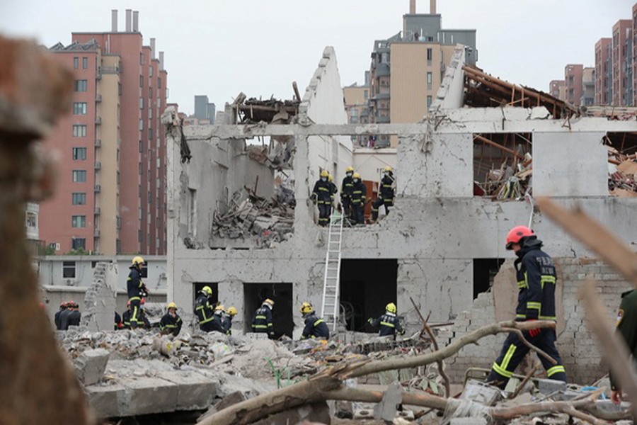 NINGBO: Rescue workers work at the site of a blast in Ningbo of Zhejiang province on Sunday. — Reuters
