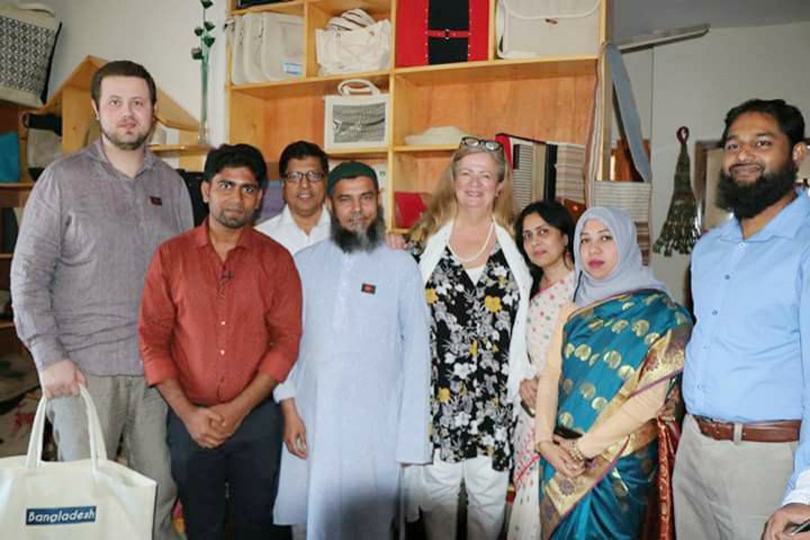 Christina Östergren (fouth from right), her son Gabriel Östergren (extreme left), Ibrahim Khalil on Christina's left and Md Abdullah Al Hasan on extreme right seen with others during Christina's visit to AJAD office at Mohammadpur in the city.