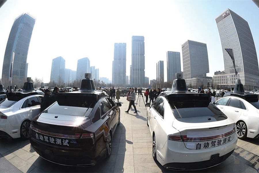 Photo taken on March 22, 2018 shows self-driving vehicles for public road testing in Beijing, capital of China. Beijing released its first temporary license plates for Baidu's self-driving vehicles for public road testing on the previous day. —Photo: Xinhua