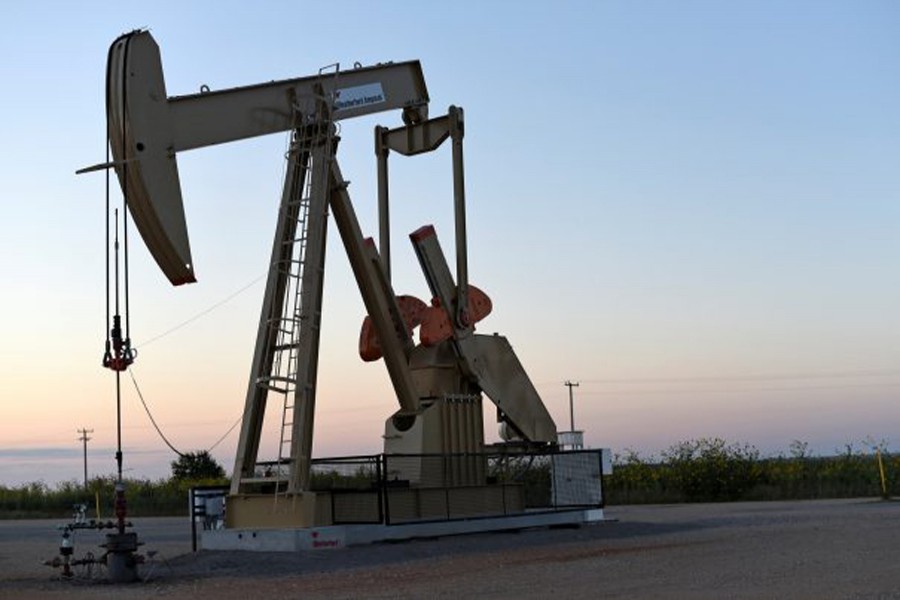 A pump jack operating at a well site leased by Devon Energy Production Company near Guthrie, Oklahoma — Reuters