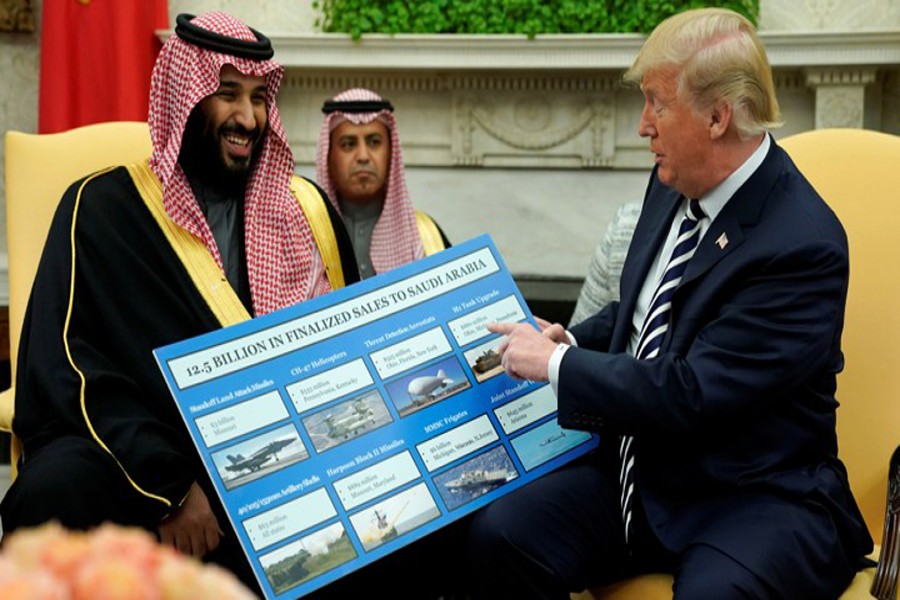 US President Donald Trump (right) holds a defence sales chart with Saudi Arabia's Crown Prince Mohammed bin Salman in the White House on March 20, 2018. -Photo: Reuters