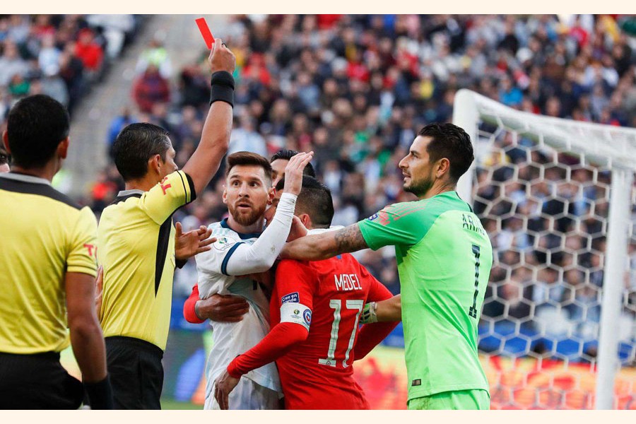 File photo: Argentina's Lionel Messi and Chile's Gary Medel scuffling as referee Mario Diaz, from Paraguay, left, shows the red card to both of them during Copa America third-place football match at the Arena Corinthians in Sao Paulo, Brazil — AP