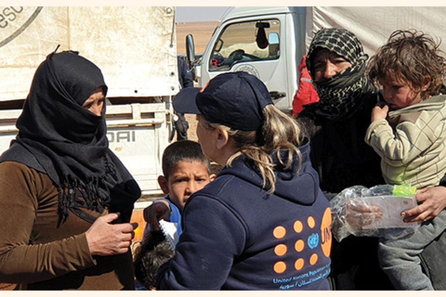 As part of the largest-ever humanitarian convoy by the United Nations and the Syrian Arab Red Crescent, UNFPA delivered on February 16, 2019 critical reproductive health supplies, hygiene and dignity kits to women and girls in the remote Rukban area of South-east Syria. Some 118 trucks brought life-saving assistance to the makeshift settlement, where more than 40,000 people are stranded in the desert. —Photo courtesy: UN in Syria via the Internet