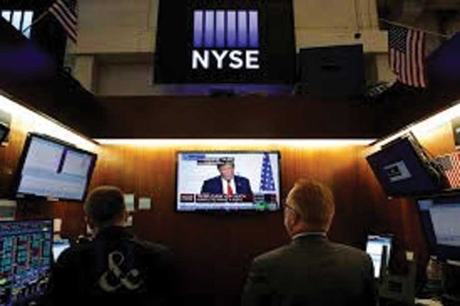 Traders watch monitors displaying a media conference with US President Donald Trump live at the G7 summit on the trading floor at the New York Stock Exchange (NYSE) in New York City, US on August 26, 2019. —Photo: Reuters