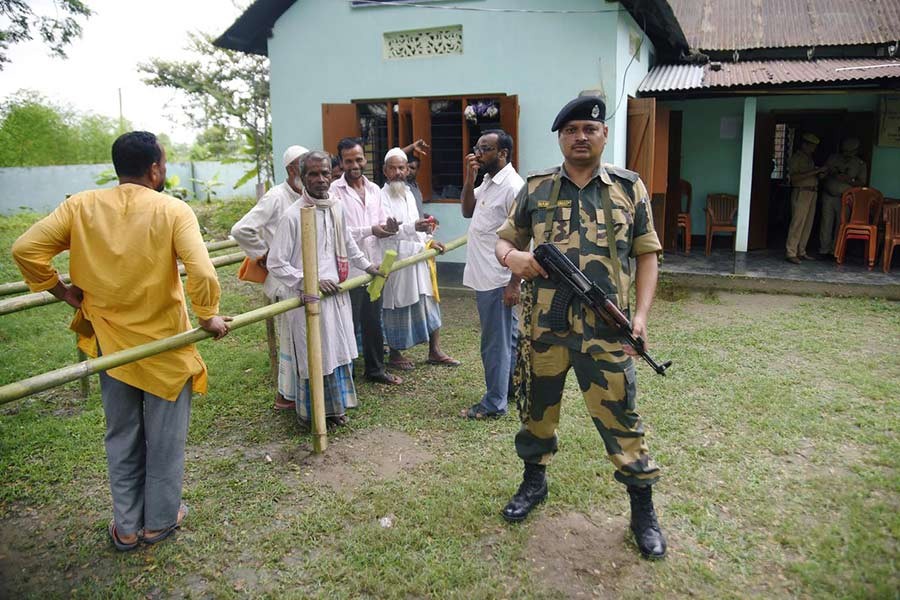 People stand in a queue to check their names on the draft list of the National Register of Citizens (NRC) outside an NRC centre in Rupohi village, Nagaon district, northeastern state of Assam, India on August 31, 2019. —Photo: Reuters