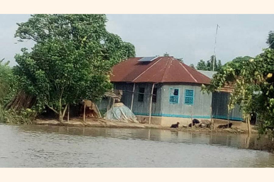 Floodwater around houses under Shibganj upazila in Chapainawabganj district — FE Photo