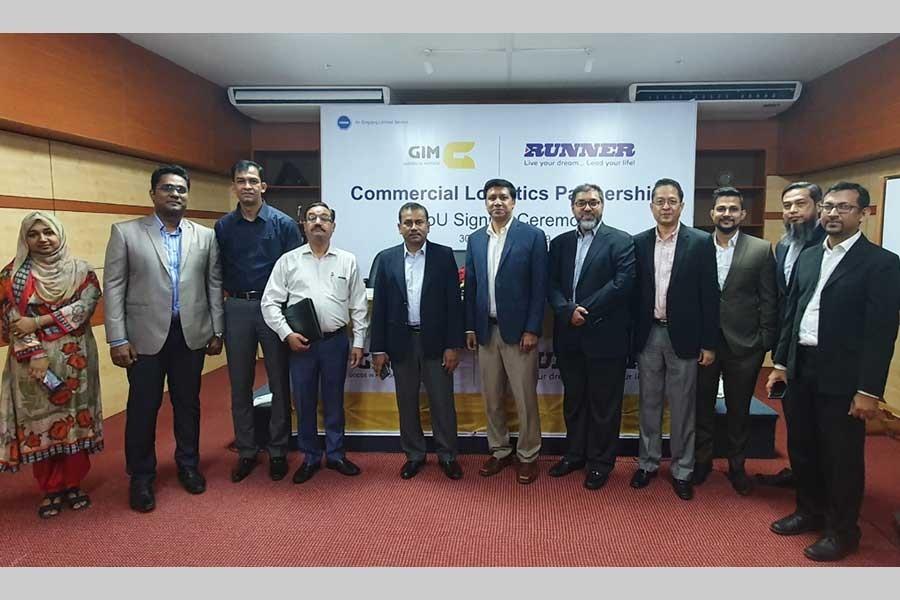 Officials of GIM Digital Truck and Runner Group pose for photograph during an MoU signing ceremony in the city recently.