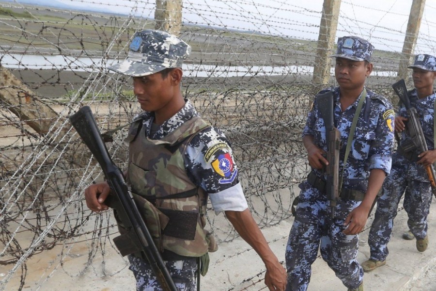 Myanmar border police patrol along a beach near a makeshift camp at the Myanmar-Bangladesh border, near the town of Maungsaw, in Rakhine State. Photo: EPA
