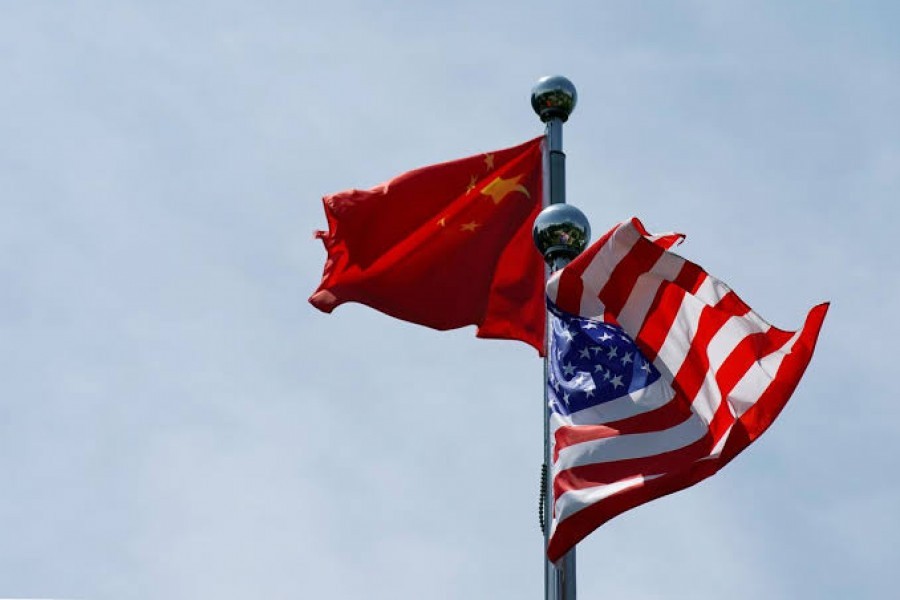 Chinese and US flags flutter near The Bund, before US trade delegation meet their Chinese counterparts for talks in Shanghai, China, July 30, 2019. Reuters/Files
