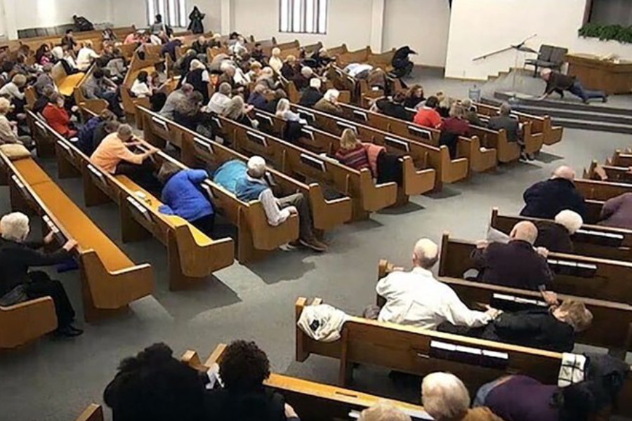 In this still frame from livestreamed video provided by law enforcement, churchgoers take cover while a congregant armed with a handgun, top left, engages a man who opened fire, near top center just right of windows, during a service at West Freeway Church of Christ, Sunday, Dec. 29, 2019, in White Settlement, Texas - (West Freeway Church of Christ/Courtesy of Law Enforcement via AP)