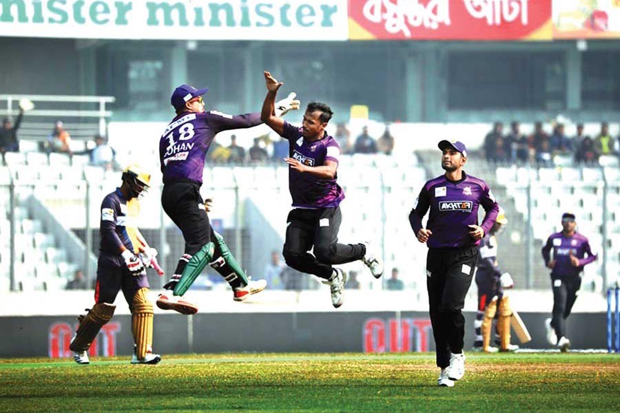 Chattogram Challengers' Rubel Hossain celebrating with teammate Nurul Hasan Sohan after getting the wicket of Dhaka Platoon's Tamim Iqbal during the BBPL match at Sher-e-Bangla National Cricket Stadium in the city on Monday — BCB