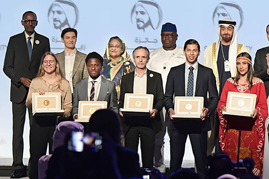 Prime minister Sheikh Hasina and other leaders pose with the winners of Zayed Sustainability Prize at ICC Hall of Abu Dhabi National Exhibition on January 13, 2020. — Photo: PID