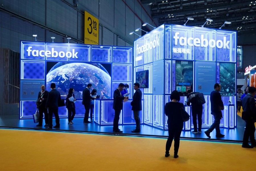 FILE PHOTO: Facebook signs are seen during the China International Import Expo (CIIE), at the National Exhibition and Convention Center in Shanghai, China November 5, 2018. REUTERS/Aly Song
