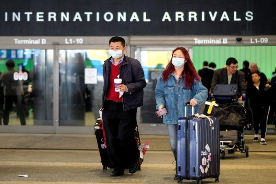 Passengers leave LAX after arriving from Shanghai, China, after a positive case of the coronavirus was announced in the Orange County suburb of Los Angeles, California, US on January 26, 2020 — Reuters photo
