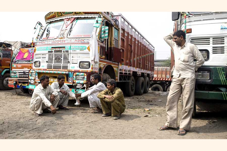 Indian truck drivers waiting at the Benapole Land Port truck terminal for their turn to unload the goods. The photo was taken on Monday — FE Photo