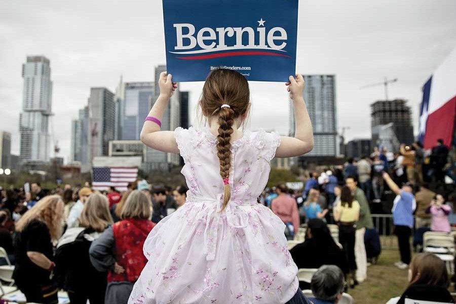 Lily Barbour, 5, holds up a campaign sign for Democratic presidential candidate Senator Bernie Sanders during a campaign event in Austin, Texas, on February 23, 2020. —Photo: AP