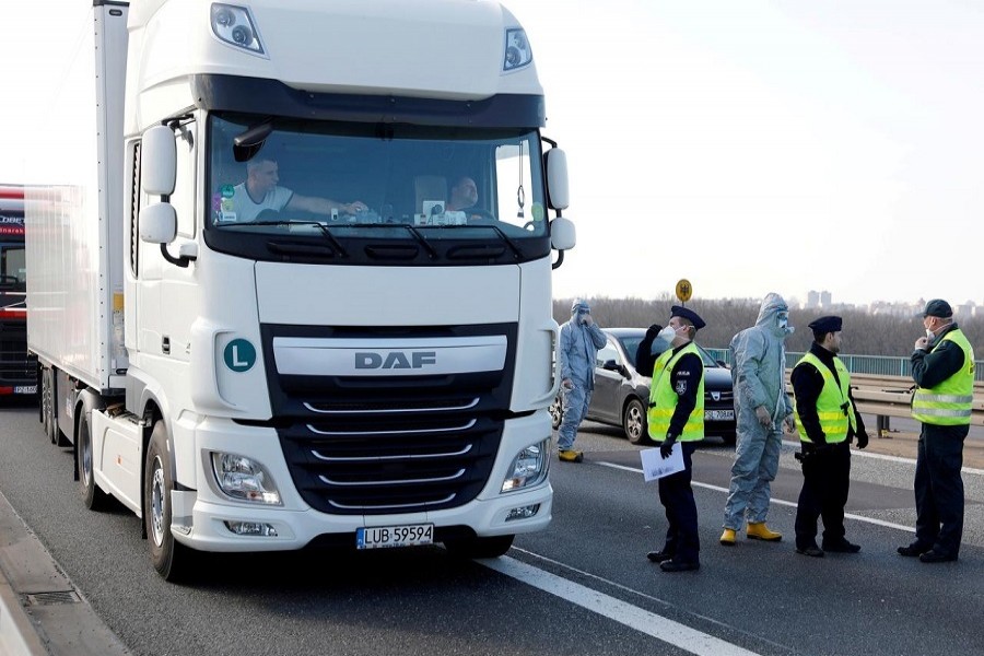 A truck driver waits for his temperature check by Polish officials, during coronavirus disease (COVID-19) symptoms testing, on the German-Polish border near Frankfurt/Oder, Germany, March 17, 2020. —Reuters/Files