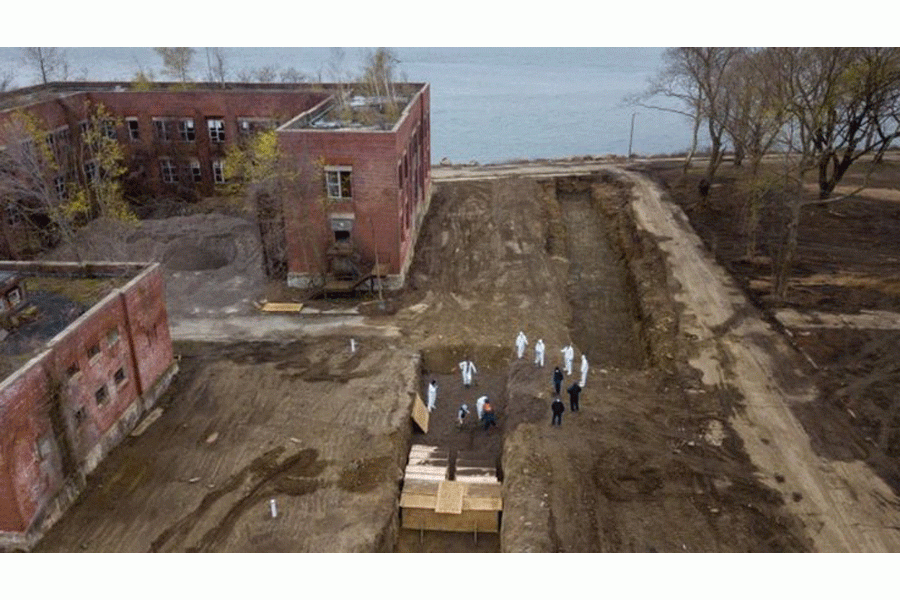 About 40 coffins were buried on Thursday.—Reuters