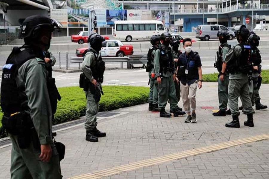 Riot police officers stand guard outside the Central Government Complex as a second reading of a controversial national anthem law takes place in Hong Kong on May 27. REUTERS
