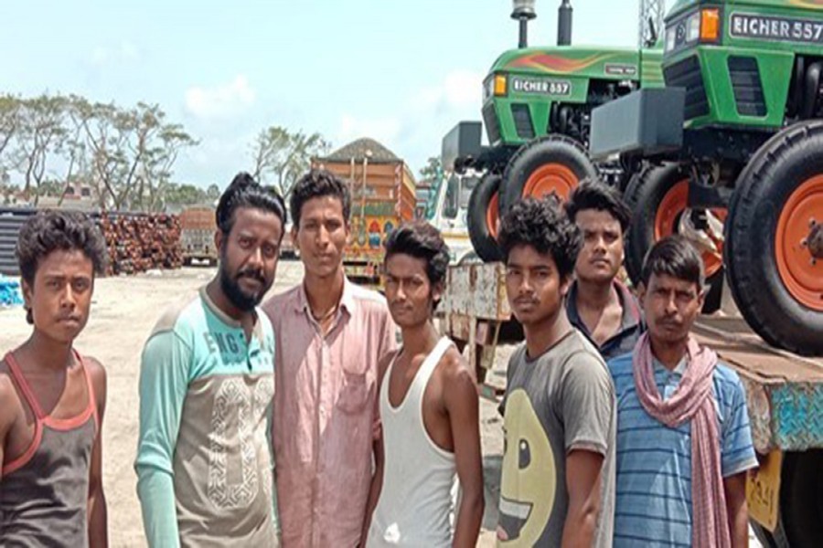 Seven of the 19 Indian truck drivers pose for photograph — FE Photo
