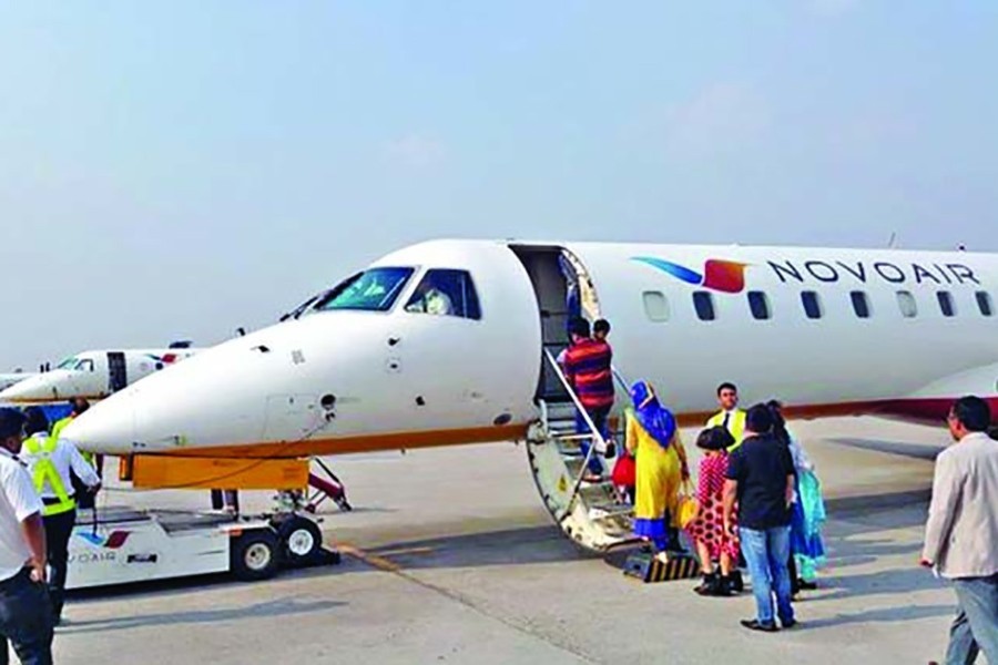 Passengers queue for boarding their flight on a Novoair service — File photo used only for representation