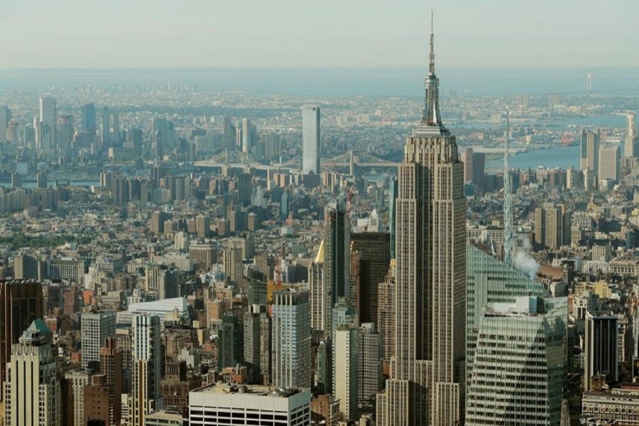 The Empire State Building rises above Manhattan in front of the Brooklyn and Manhattan bridges as seen from an apartment in the Central Park Tower building as the building celebrates its topping out in New York, US, September 17, 2019 — Reuters/Files