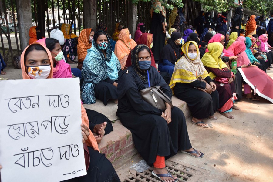 Workers of Dhaka Export Processing Zone garment factory A-One BD Ltd protest in front of National Press Club in Dhaka demanding due wages — File photo