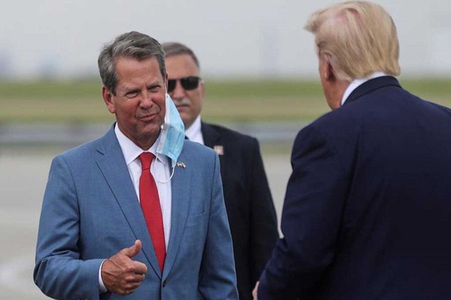 FILE PHOTO: US President Donald Trump is greeted by Georgia Governor Brian Kemp as he arrives at Hartsfield-Jackson Atlanta International Airport in Atlanta, Georgia, US, July 15, 2020. REUTERS