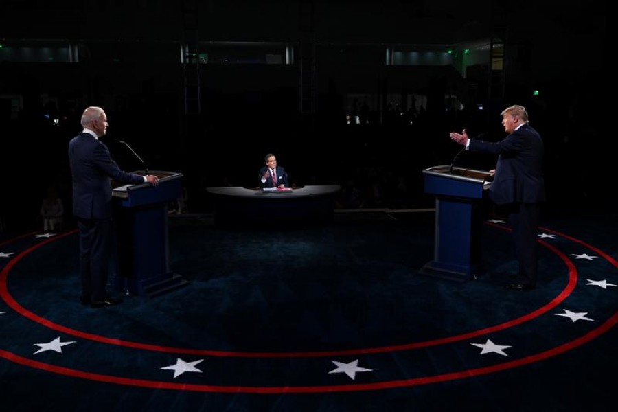 US President Donald Trump and Democratic presidential nominee Joe Biden participate in the first 2020 presidential campaign debate held on the campus of the Cleveland Clinic at Case Western Reserve University in Cleveland, Ohio, US, September 29, 2020. Olivier Douliery/Pool via REUTERS