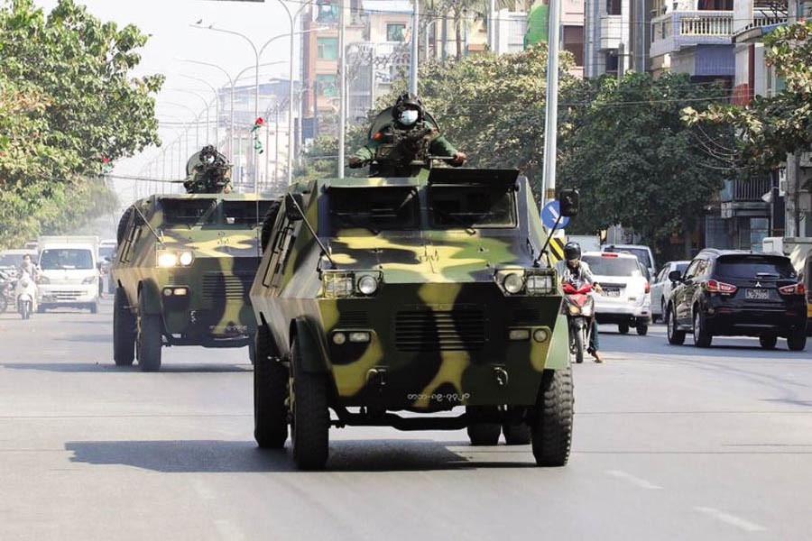 Myanmar army armoured vehicles drive in a street after the military seized power in a coup in Mandalay, Myanmar, February 3. —Reuters